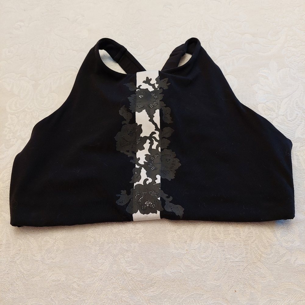 Athleta black with floral design sports bra. Size medium